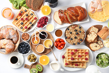 Poster - Different meals served for breakfast on white table, flat lay