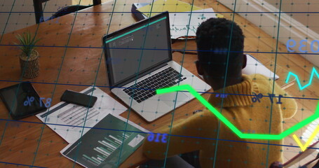 Poster - Image of financial data processing over african american businesswoman using laptop