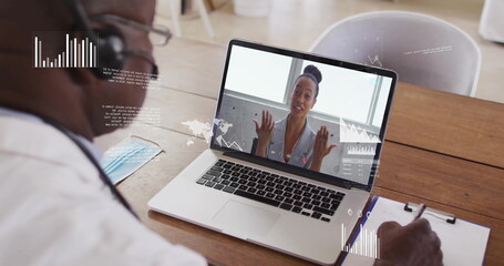 Poster - Image of financial data processing over african american businessman using laptop for image call