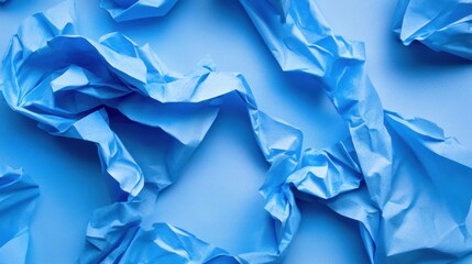 Poster - The background presents a variety of crumpled blue paper textures, showcasing intricate patterns and folds ideal for artistic use
