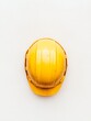 © Ryzhkov - Minimalist Aerial View of Yellow Hard Hat on Roof of Unfinished Skyscraper