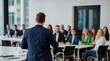 © VistaVisions - Confident businessman giving a presentation in front of crowd in meeting conference seminar room. Leadership authority teamwork in business concept