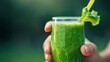 © Atchariya63 - A refreshing green smoothie served in a glass, ideal for health and wellness themes, promoting nutrition and vitality.