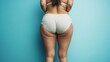 © Yeivaz - Woman with visible cellulite on her thighs and buttocks on blue background. Overweight liposuction