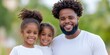 © MstSanta - African American happy family with blur nature background