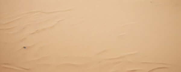 Poster - a close-up view of a sandy beach, with the sand's undulating texture and small grains visible.