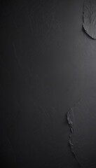 Fototapete - a dark, textured surface with a small, jagged, and irregularly shaped piece of stone or rock on the right side, creating a sense of contrast and depth.