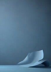 Aufkleber - Abstract art piece featuring a curved, folded paper against a dark blue background.