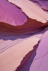 Aufkleber - a close-up view of a rock formation with a mix of pink and purple hues, creating a visually striking and abstract pattern.