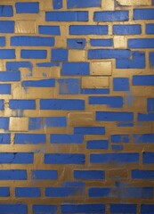 Aufkleber - a close-up view of a textured wall surface composed of blue and gold bricks, with a mix of blue and 