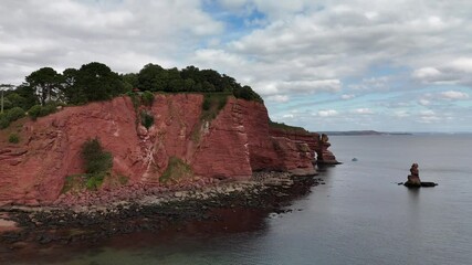 Sticker - Aerial footage of the Parson and Clerk cliffs and Shag Rock in Teignmouth, Devon, England, UK