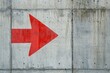 © grey - A bold red arrow on a grey concrete wall
