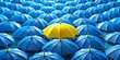 © Fist - a collection of blue umbrellas with a single yellow umbrella