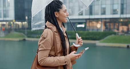 Woman, outdoor and smile with umbrella on smartphone with rain drops or commute for job interview. Female employee, profile and smile on internet with map for direction or navigation for direction