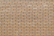 © bykot - Seamless beige brick wall texture with horizontal rectangular bricks.