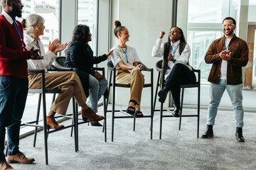 Wall Mural - diverse group of professionals talking and engaging in a business conference event