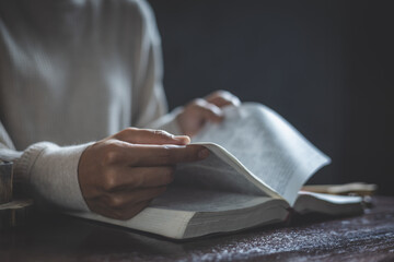 woman reading and studying the bible,  Holy Bible for faith, spirituality.