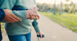 © David/peopleimages.com - Park, walking stick and caregiver with senior woman for assisted living, support and care in nature. Retirement, help and hands of elderly person with disability for wellness, health and recovery