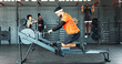 © peopleimages.com - Man, rowing machine and gym for exercise, fitness and training for muscle development in class. Person, nerd and challenge with equipment for routine, bench and progress for body at wellness club