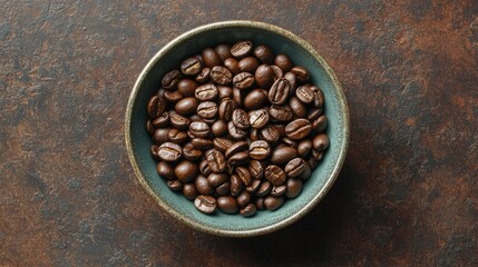 A bowl of freshly roasted coffee beans arranged neatly on a dark brown surface, symbolizing aroma and richness.