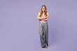 © ViDi Studio - Full body young smiling happy employee business woman corporate lawyer wear classic suit vest white t-shirt glasses work in office hold hands crossed folded isolated on plain pastel purple background.