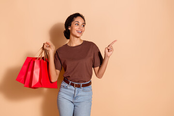 Sticker - Photo of cheerful lovely adorable woman wear stylish clothes recommend offer empty space isolated on beige color background