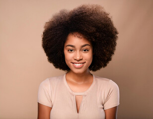 Wall Mural - Portrait of cheerful beautiful smiling African American woman with afro hair brunette isolated on brown background