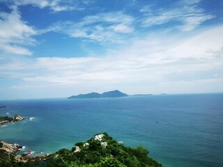 Poster - Serene coastal landscape with distant island