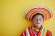 © dvoevnore - Young Hispanic man in traditional attire against colorful background