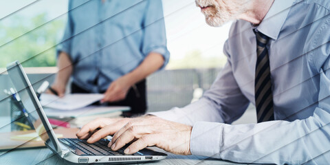 Poster - Mature businessman using a laptop, geometric pattern