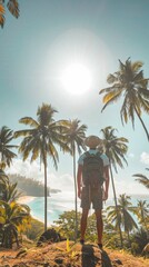 A solo hiker standing on a cliff with a large backpack, gazing at a tropical beach below, surrounded by palm trees under bright sunlight. Vertical format photo  adventure, exploration, nature