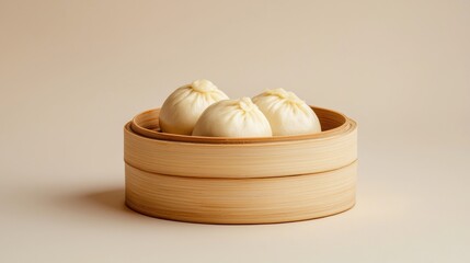 Three dumplings are in a wooden bowl