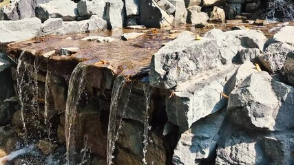 Poster - Artificial waterfall made of stones.