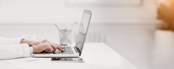 Poster - Freelance. Close up of woman using laptop, working at home, writing a blog, hands on keyboard. Copyspace, panorama