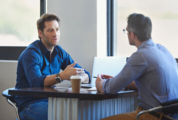 Fototapete - Meeting, laptop and business people in discussion at coffee shop for planning, conversation and talking. Professional, collaboration and men in restaurant on computer for feedback, review or teamwork