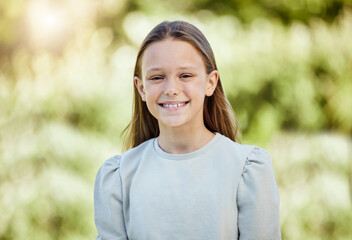 Portrait, smile and child in park, outdoor and happy in nature, fresh air and relax in morning and plants. Spring, grass and girl in environment, peace and kid in backyard, break and calm in weekend