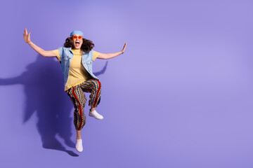 Poster - Full size photo of pretty retired woman jump excited wear trendy denim hipster outfit isolated on violet color background