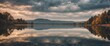 © Den Boro Day - Tranquil Lake Landscape with Dramatic Cloudy Sky Reflection - Nature Serenity Scene.