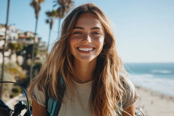 A cheerful woman with long hair stands on a sunny beach, the ocean waves and palm trees visible behind her, radiating happiness and vacation vibes.