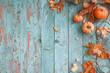 © Elena - Scary Halloween jack o' lantern pumpkin with a cut out face on wooden boards on a dark blue background with fog