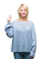 Wall Mural - Young beautiful blonde woman wearing winter sweater over isolated background showing and pointing up with fingers number four while smiling confident and happy.