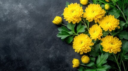 A vibrant arrangement of yellow chrysanthemums on a dark surface.