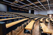 © Octavian - Empty college or university classroom or lecture hall. Wooden desks and benches, no people