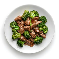 Wall Mural - Savory stir-fried beef and broccoli on a white plate with vibrant greens