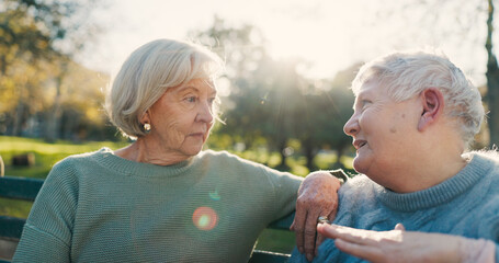 Canvas Print - Friends, conversation and senior women in park for bonding, talking and relax together outdoors in morning. Happy, retirement and elderly people on bench in discussion, chat and laughing in nature