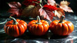 © Zoya - Three small pumpkins with autumn leaves on a dark reflective surface