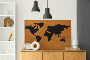 Wall Mural - Photo frame, vases and world map on wooden chest of drawers near white wall in living room