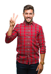 Wall Mural - Young handsome man over isolated background showing and pointing up with fingers number two while smiling confident and happy.