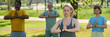 © pressmaster - Long exposure of mature intercultural men and woman repeating yoga exercise after female instructor with namaste gesture
