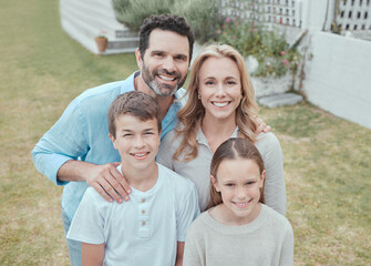 Wall Mural - Family, portrait and smile at home for bonding, relax and support together with face on weekend. Parents, happy and children at backyard of house for care, leisure and love with fun break in Germany